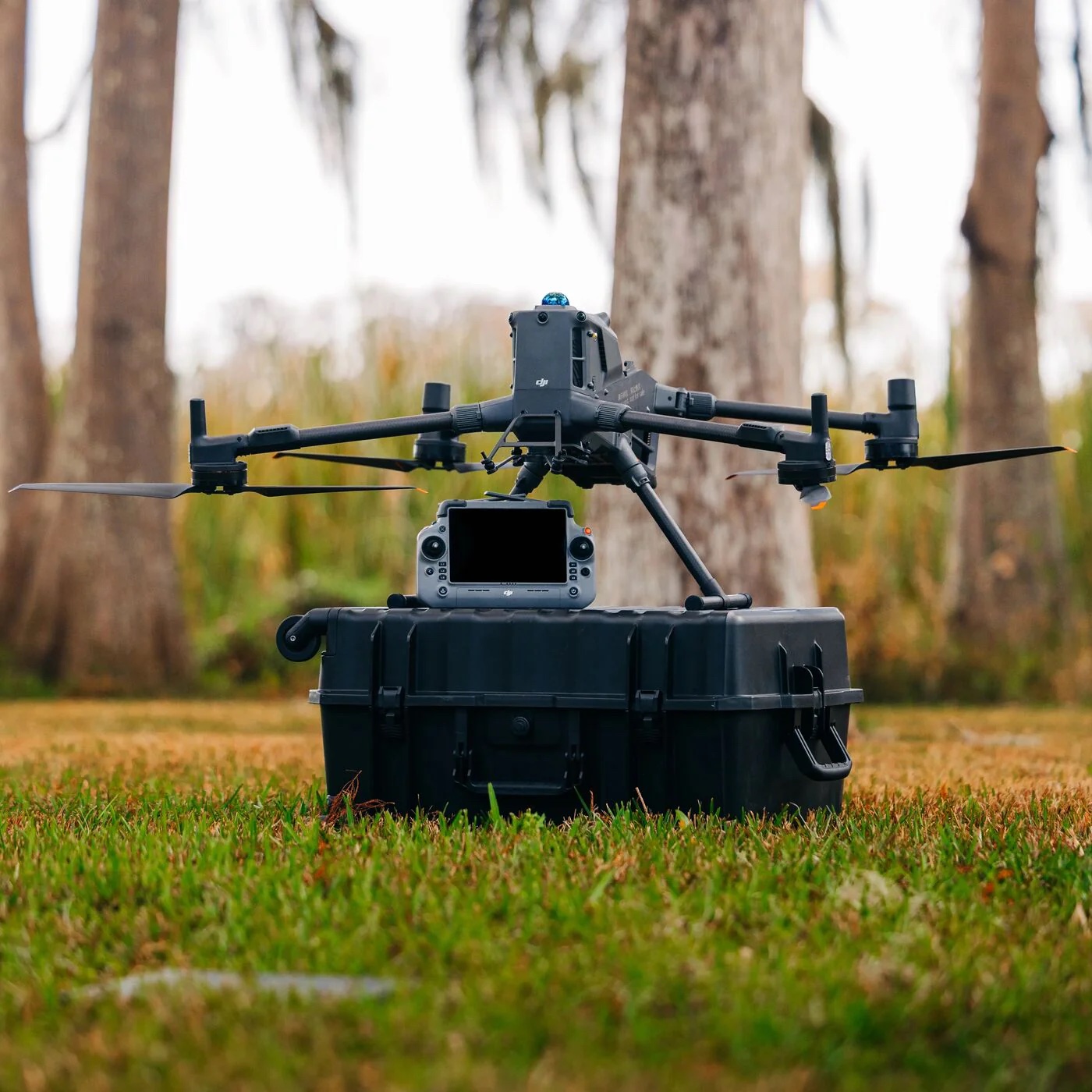 DJI Matrice drone and controller staged on a Pelican case in the field